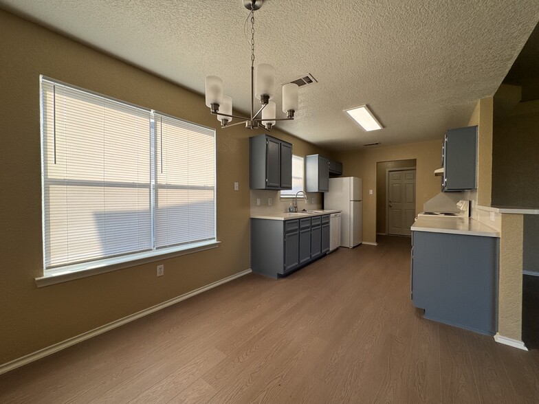 Adjacent to the patio door and kitchen, the dining space is perfect for family dinners or homework s - 2806 Maria Dr
