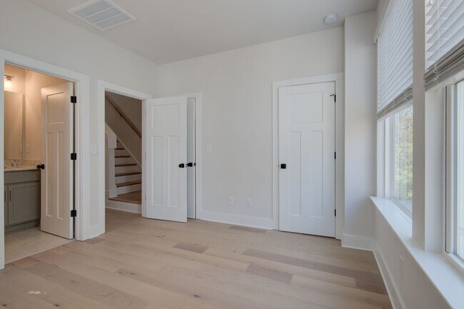 Building Photo - COMING SOON! Modern End-Unit Living Near Uptown | Rooftop Terrace + Tandem Garage