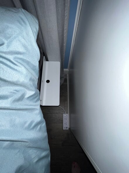 Below each bed shelf is an extension cord for phone or electronic charging - 908 Lake Rd