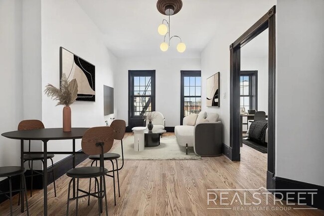Building Photo - Timelessly Renovated Historic Triplex with...