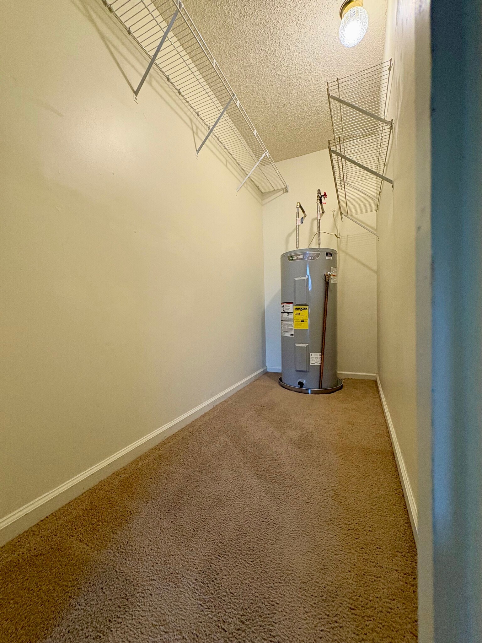Master bedroom closet with hot water tank - 208 Quarter Trl
