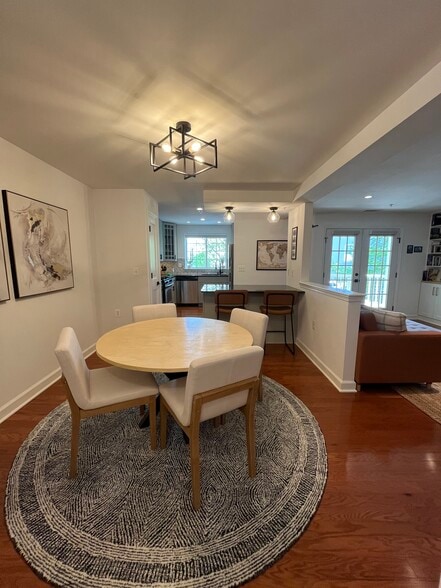 Open floor plan featuring dark wood flooring throughout. - 4079 S Four Mile Run Dr