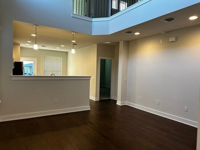 Building Photo - For Lease – Modern 2023 Condo Backing to Greenbelt | Creekside at Pioneer Crossing West