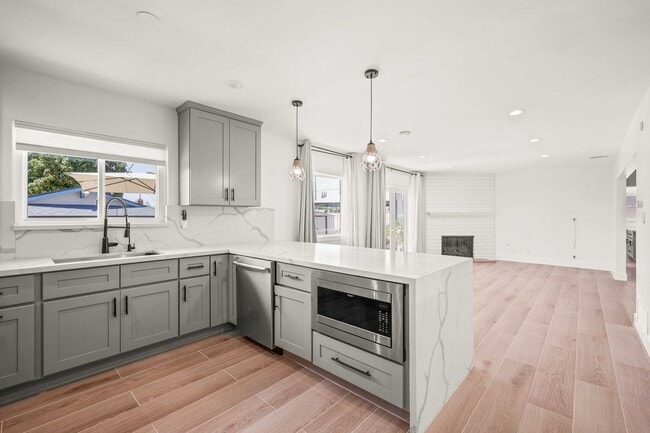 Building Photo - Stylishly Remodeled 4-Bedroom Home in Prim...