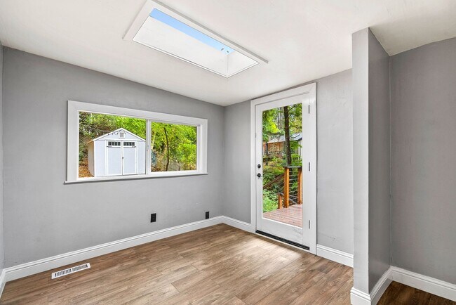 Building Photo - 1 Month FREE!! Riverfront Haven with Priva...