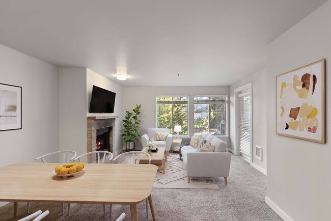 Enjoy a living room designed for both comfort and charm, with expansive windows that flood the space with natural light. - Windsor Juanita Bay