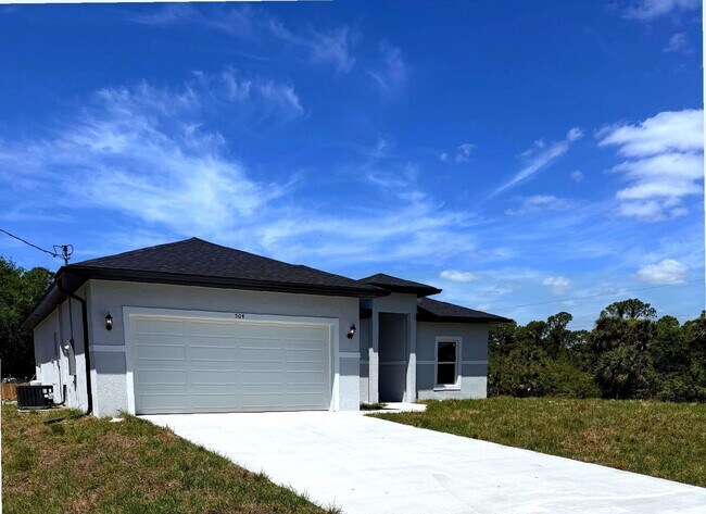 Building Photo - New 4 Bed / 2 Bath / 2 Car Garage Family Retreat in Desirable Lehigh Acres!