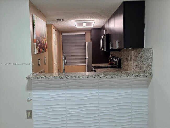 Building Photo - 9917 W Okeechobee Rd