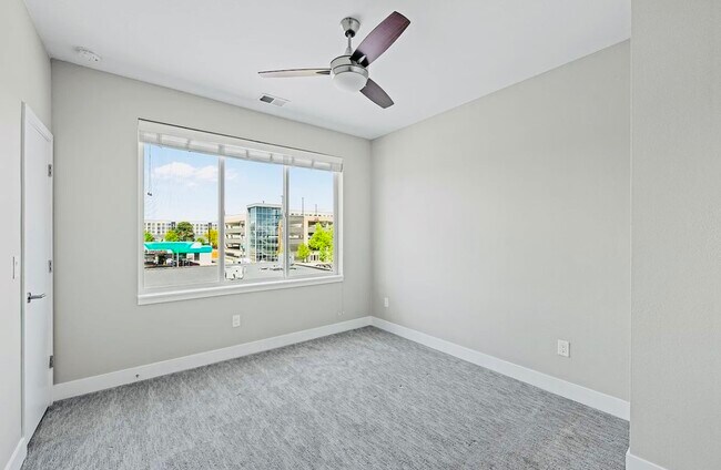 Experience tranquility in this well-lit bedroom, perfect for relaxation and style. - Harley House