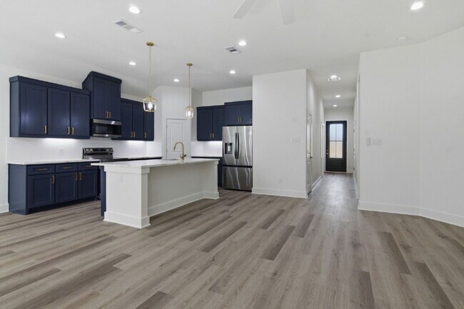 Building Photo - "New Construction 3-2-2 Home with Designer Touches Throughout!"