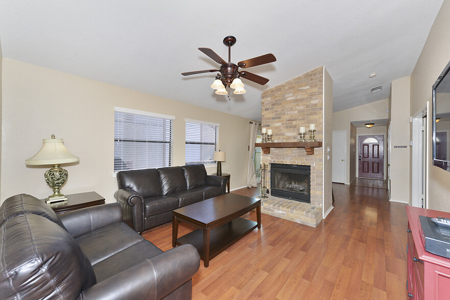 Living Room with Fireplace &amp; Ceiling fan - 13035 Brook Garden Ln