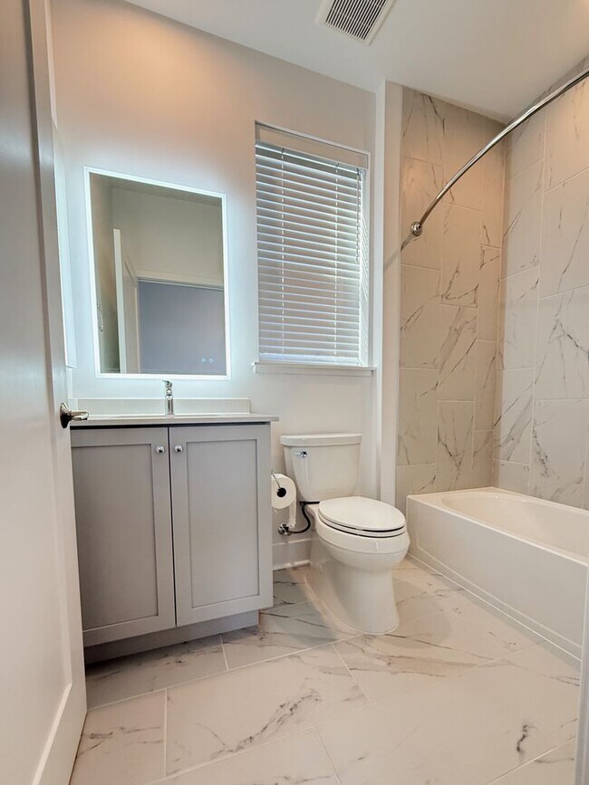 Building Photo - Brand new 4 level, 4 Bedroom Townhome with Elevator!