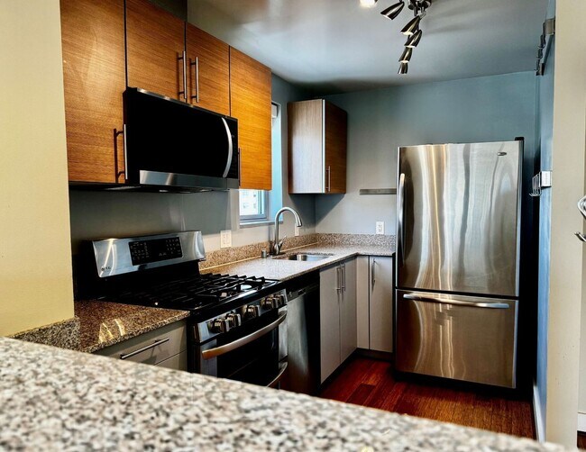 Building Photo - Corner Light. City Energy. Zero Compromise.