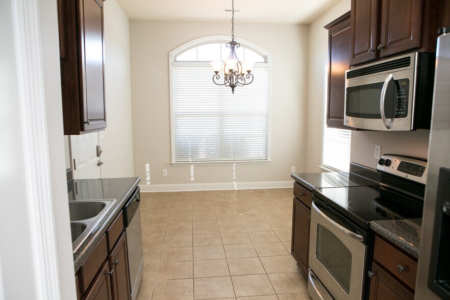 kitchen with dinning in background - 307 Dovington Dr