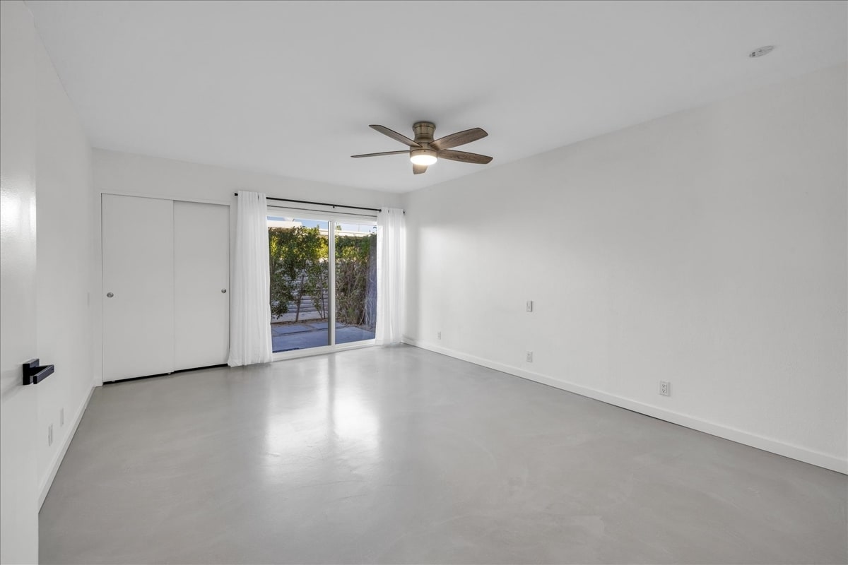 Primary Bedroom with Door to private Patio - 1111 E Ramon Rd