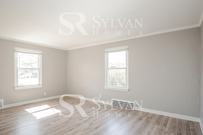 Building Photo - This home exudes a cheerful and welcoming charm!