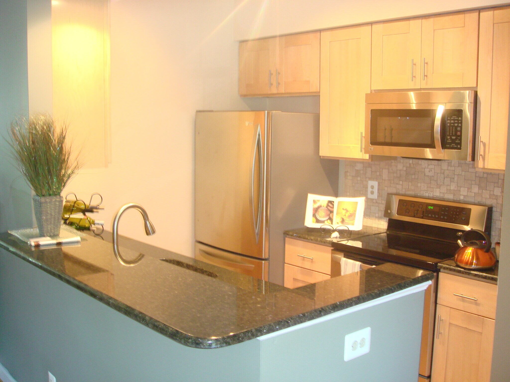 Kitchen view over granite countertop - 5917 Barbados Pl