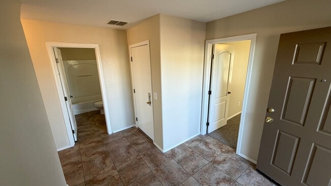 Building Photo - Spacious Surprise home with large backyard