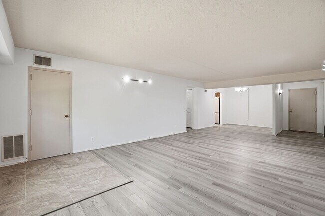 Building Photo - This expansive ground level residence is set within a serene, gated garden community surrounded b...