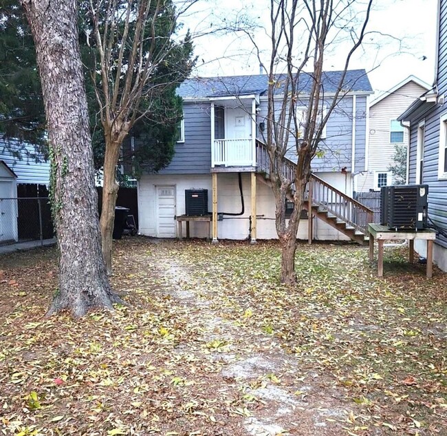 The backyard is entirely fenced in. This space is shared with other tenants on the property. - 1900 North St