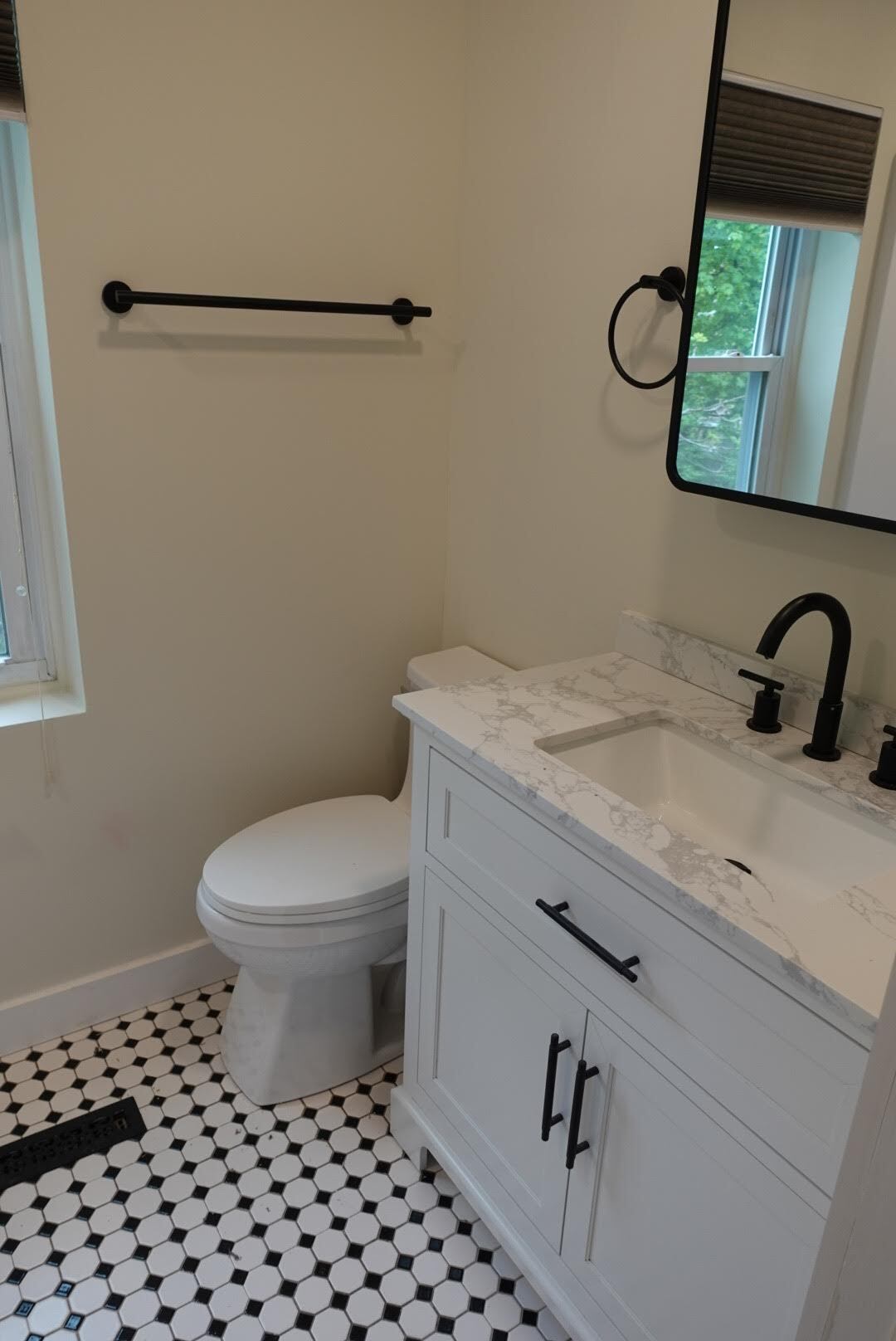 2nd Floor full bathroom is also fully renovated with black fixtures, new toilet, vanity and shower - 327 Hudson Ave