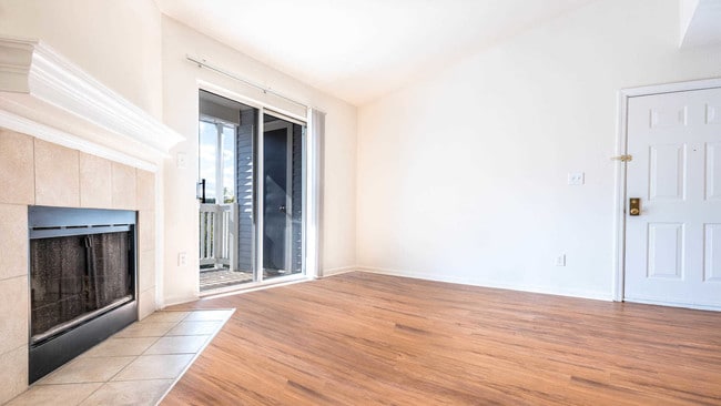 Living Room with Hard Surface Flooring, Balcony and Wood-Burning Fireplace - Lincoln Heights