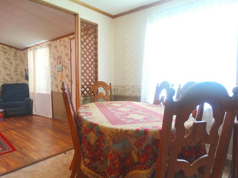 Dining room with a table, 6 chairs and china cabinet - 118 W Rogers St