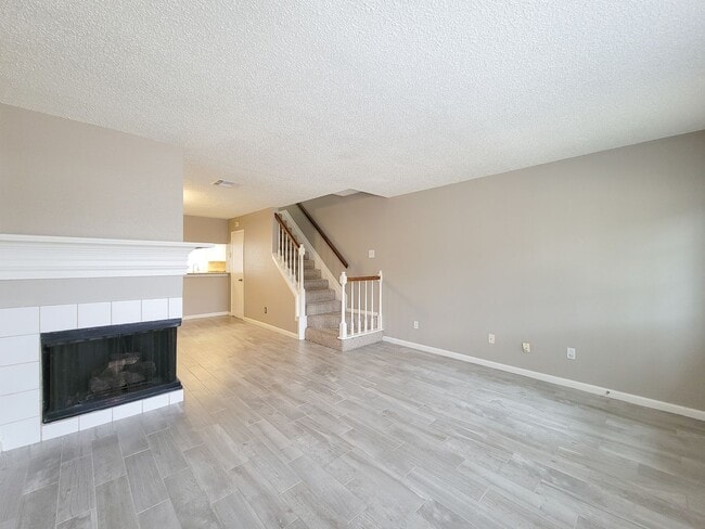 Building Photo - Welcome to This Charming Townhome Nestled ...