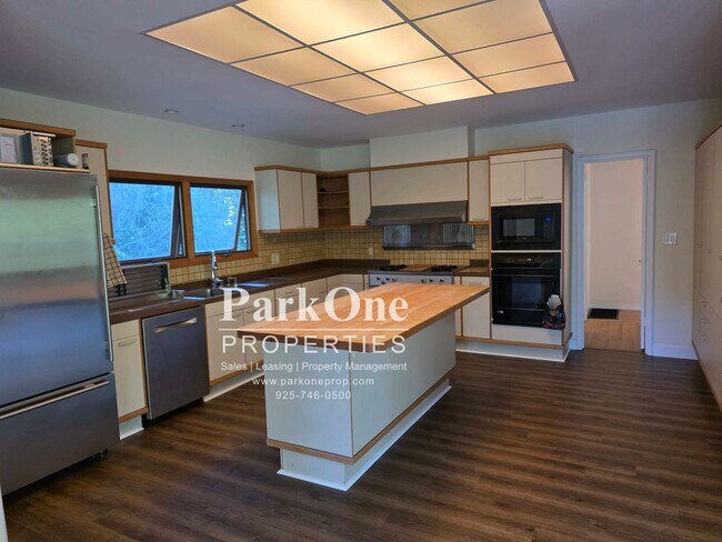 Building Photo - Spacious Home on a Private Wooded Lot Now Available!