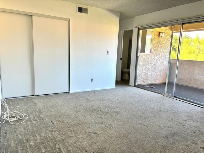 Building Photo - Available Now is a Condo style Townhouse i...