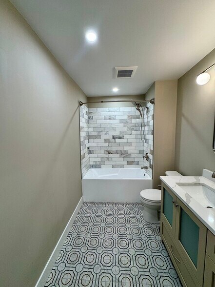 Bath Shower combination with dual shower heads and marble tile surround and quiet ventilation system - 136 E King St