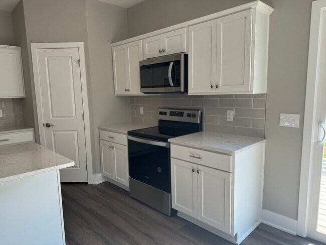 Building Photo - Luxury Bennington Townhome Ready For Move In