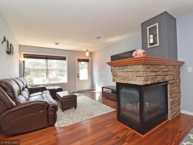 Building Photo - 3 Bedrooms | Loft | Upper-Level Laundry | 3-Sided Fireplace | Woodbury