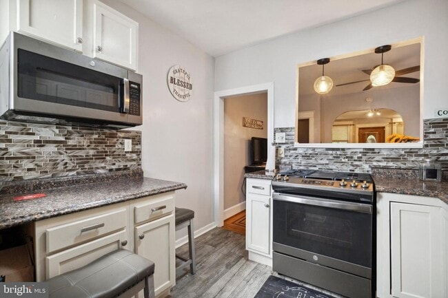 Building Photo - 7117 Woolston Ave