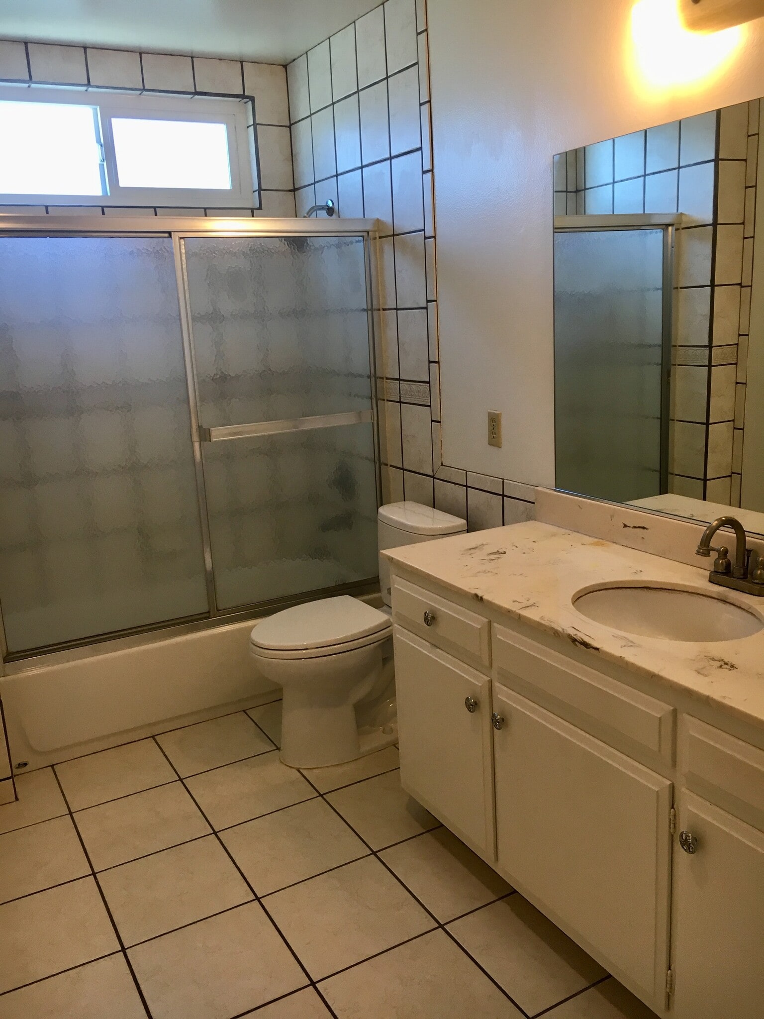 Large bathroom with shower and tub; tile flooring, large sink counter space - 18630 Del Rio Pl