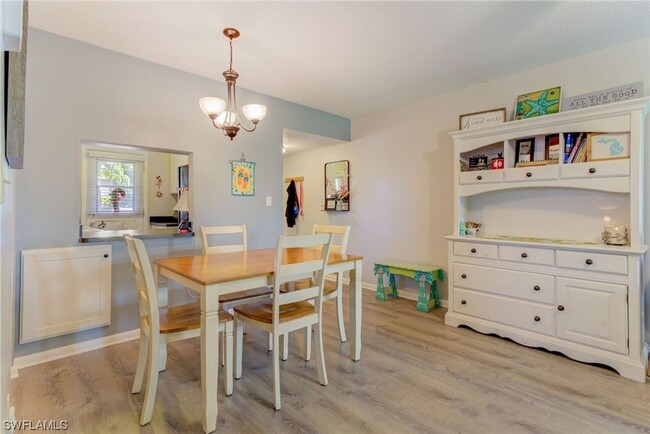 Building Photo - 55+ Charming first-floor condo nestled in ...