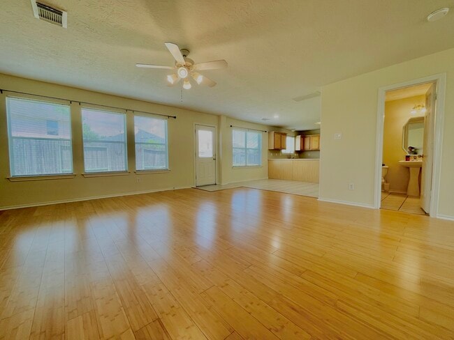 Living connects to breakfast area followed by the kitchen. - 18911 Piney Bend Ct
