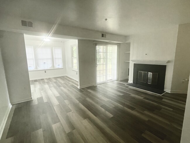 Main living area featuring fireplace and dining area - 2010 Alice Ave