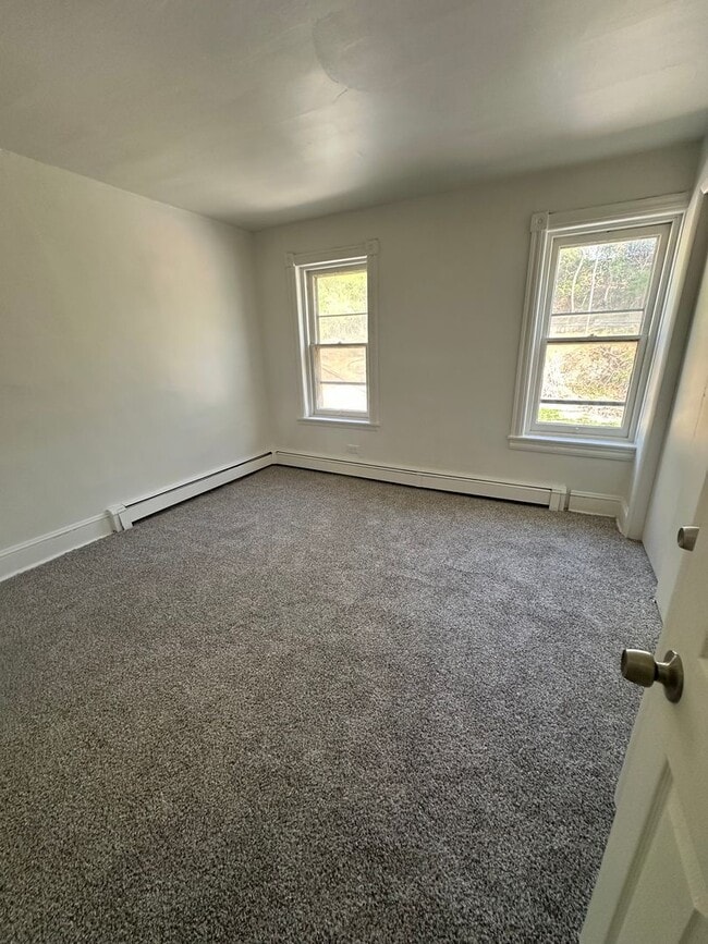 Building Photo - Renovated 4-Bedroom Home with Private Backyard – Available Now