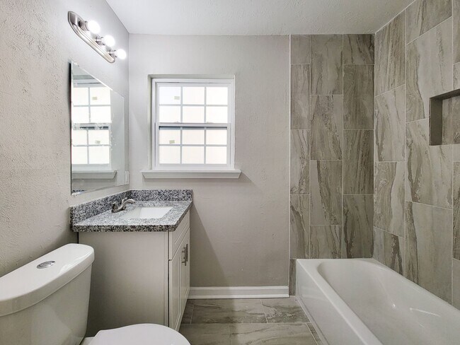Building Photo - REMODELED/ UPDATED 4 BEDROOM 2 BATH WITH C...