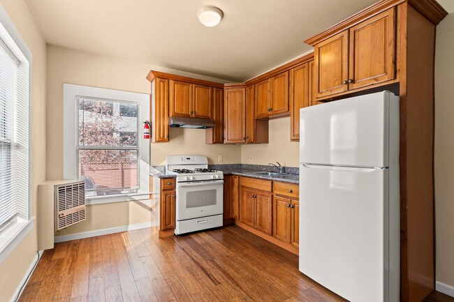 Building Photo - Utilities Included! Bright 1BD w/ Granite Kitchen & Plank Flooring