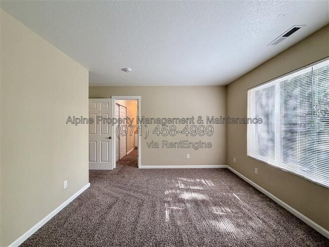 Building Photo - 5758 NE Damsel Dr