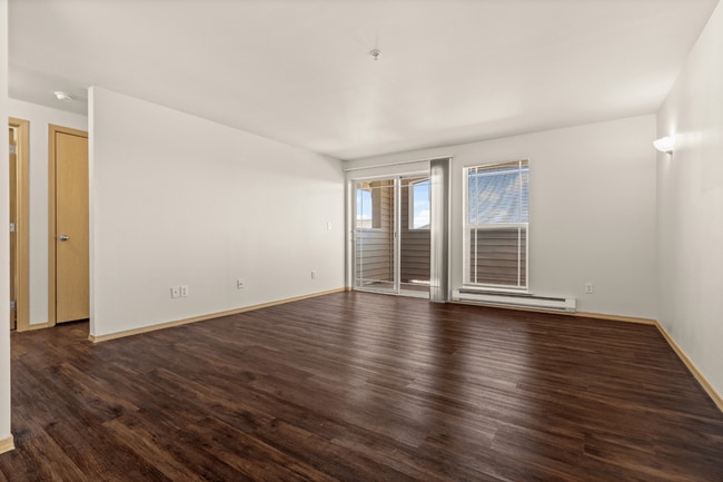 Living Room + Balcony l 2x2 Standard l Villas at Lawrence Apartments - Villas at Lawrence
