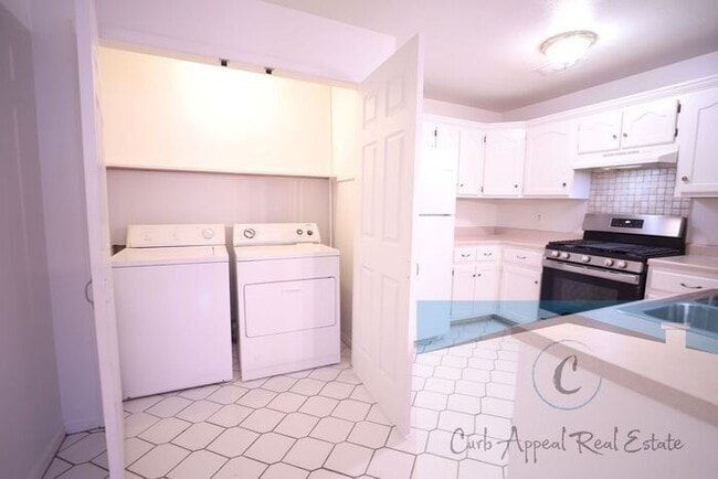 Building Photo - First month move in special $900!! Beautiful 3-bed, 2 bath condo with 2-car garage - includes was...