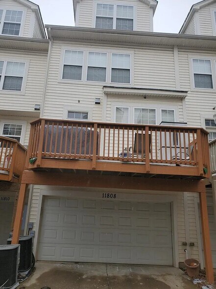 Rear with 2 car garage - 11808 Oxbridge Dr