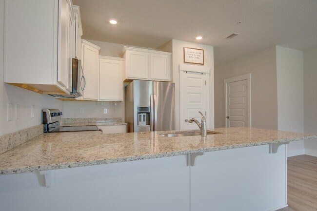 Building Photo - Spacious North Pensacola Townhome Featuring Modern Finishes, Granite Kitchen, Private Garage, Com...