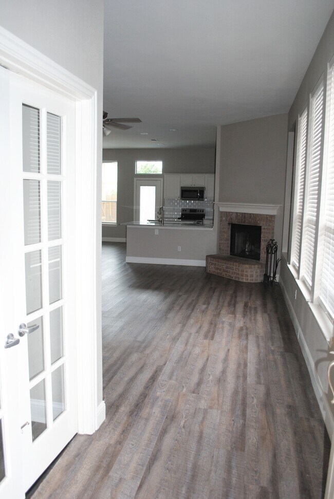 Livingroom/Kitchen from Front Door. Bed 4 on left - 341 Port O Conner Dr