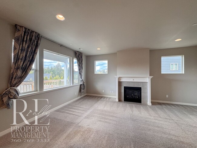 Building Photo - Vaulted Ceilings, Tree-Lined Views & a Spacious Primary Suite Retreat