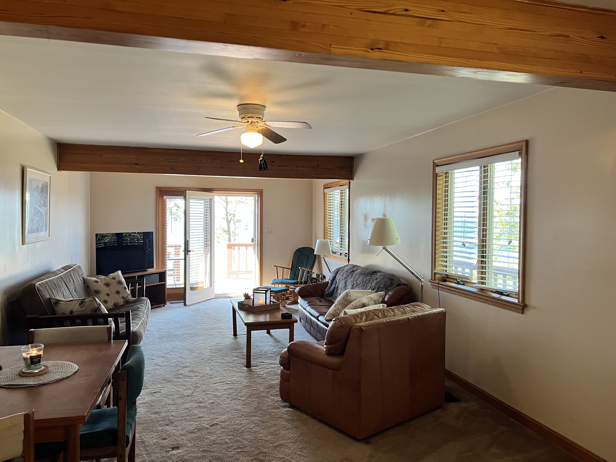 Living room opens out onto patio deck and private beach - 13113 River Ter