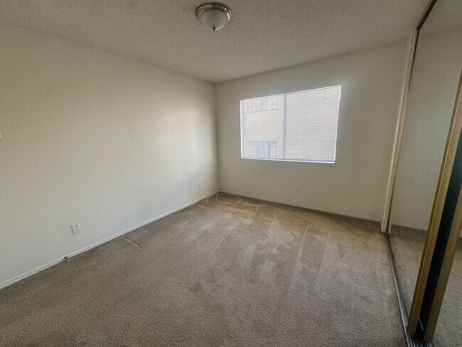 Building Photo - $2,395! Spacious Upstairs 2 Bedroom, 2 Bathroom Apartment with 2-Car Garage! 90710